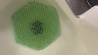 Almost Caught in action at the urinal Pinching off/on Janitor saw wet floor