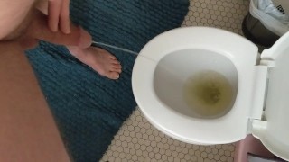 Struggling to pee with half hard cock after hot masturbation session