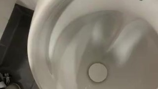 Having a risky wank in public toilets 