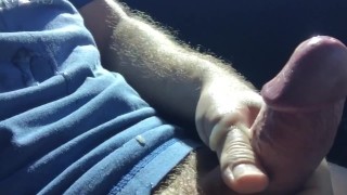hung jock jerks off slaps fat cock in car in public parking lot
