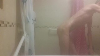 Hot very skinny guy with flat butt strokes his wet cock and pisses