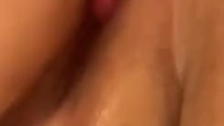 Toying her pink pussy