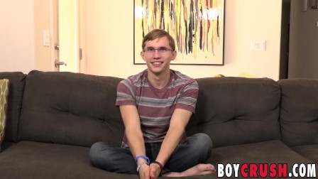 Nerdy twink strips to reveal his big dick and stroke it
