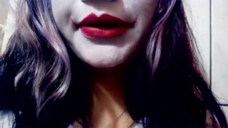 Harley Quinn playing with her mouth