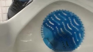Pissing at a urinal. 