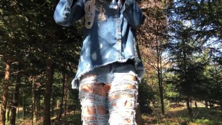 Outdoor play with her pierced and tattooed pussy in jeans