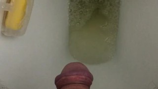 Peeing in the toilet.