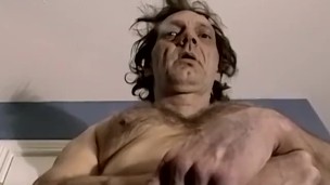 Older man strips naked and jerks off solo for cumshot on cam