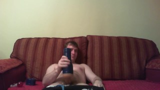 Watching porn playing with a blue fleshlight