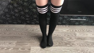 teen girl show her college knee high black socks