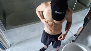 Muscled guy flexes and spreads cum all over his hard body after a workout
