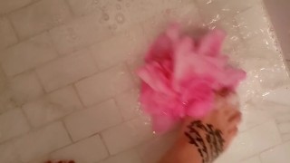 The Queen playing in bubbles cleaning feet
