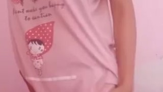 Asian teen showing off cute pink dress for daddy