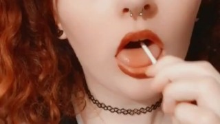 Redhead tease with a sucker 