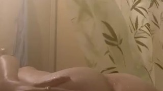 Horny teen plays with herself in shower 