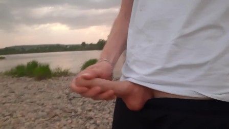 Guy Fingering Dick On The Beach In The Evening