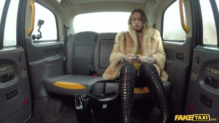 Fake Taxi Ava Austen rides a big ebony dildo on the backseat