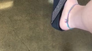 Teasing My mechanic with my stinky feet and dangling flip flop!