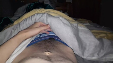 Skinny british lad strokes his cock until he cums in his bed at night