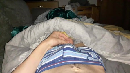 Skinny british lad strokes his cock until he cums in his bed at night