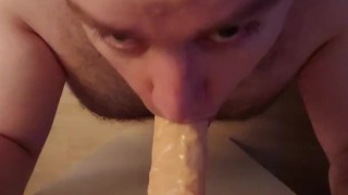 Fat hairy guy gives dildo blowjob