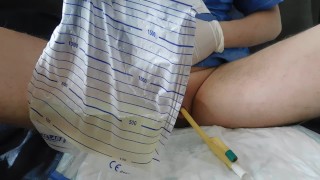 filling the bladder with an inserted catheter CH 28FR