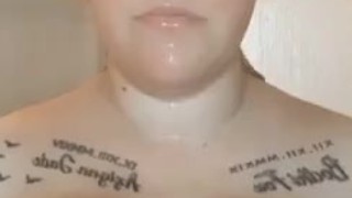 Sexy blonde babe with huge tits, playing with them in hot shower