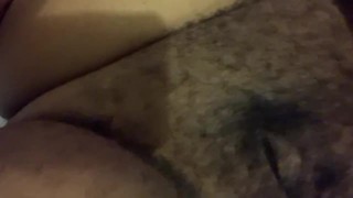 Ebony girl plays with her hairy pussy