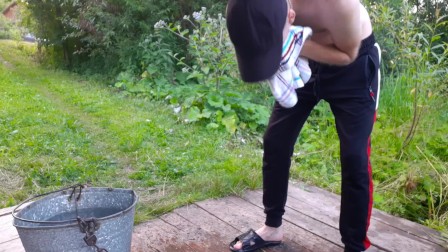 Russian country boy jerks off in the morning near the well