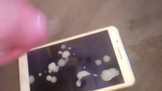 Cumming a nice white load on tablet.