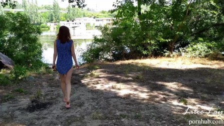 Walking naked along the river bank.