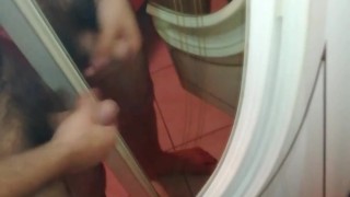 Hairy uncut guy jerks off to mirror with lots of dicks