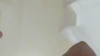 Black slut pisses in the shower