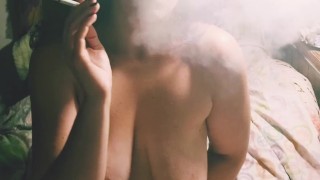 Smoking chubby teen playing with vibrator 