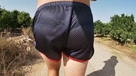 SO HOT! RUNNING WITH MY ERECT COCK OUT WEARING SHINY SEE THRU COCK SPORT SHORTS