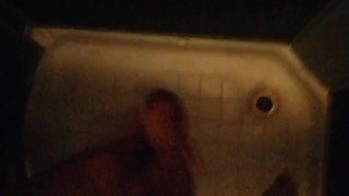 Jerking off a big cock in the shower