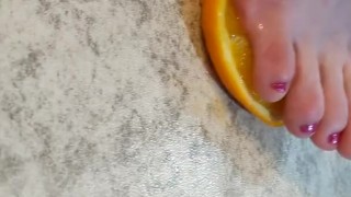 Orange crushed by virgin feet 