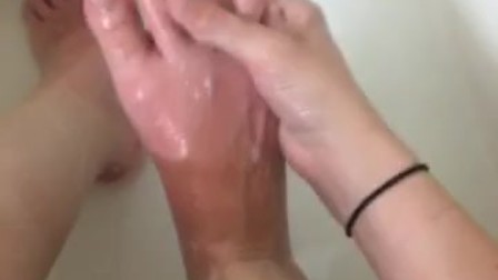 Girl washing sore feet and ankles after working long shift