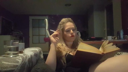 reading a book and smoking cigarette