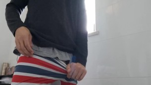 Pulling my trousers and underwear down and jerking off in the toilets