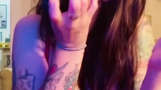 tattooed Gamer girl GiGi licks cum off of dildo