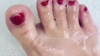 Cute toes in a bubble bath