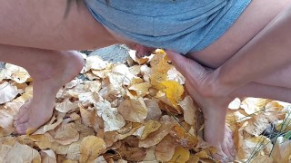 Squatting to pee in some leaves