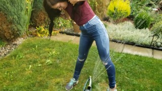 Wetting My Jeans Into sockless Shoes then soaking in the sprinkler