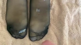 Cumming onto nylon feet...