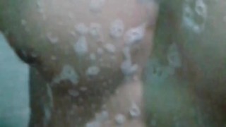 Jerking off while taking a shower