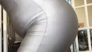 Humping & bouncing the pole & chair on handcuffs wearing shiny silver spandex