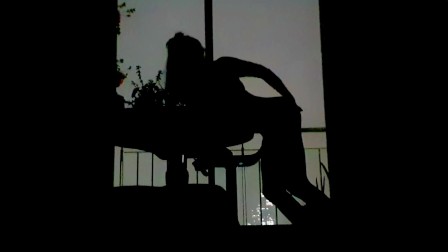 Silhouettes in the balcony at night