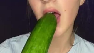 Testing little mouth with a huge cucumber. Drool, deep throat.