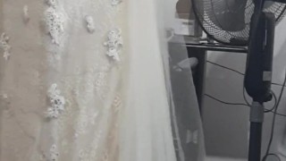 Crossdresser wearing bridal dress